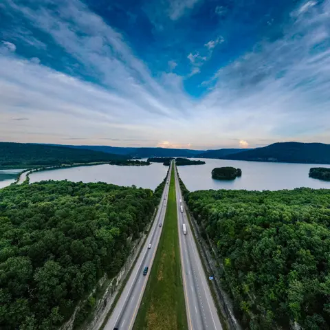 Top view highway crossing lake